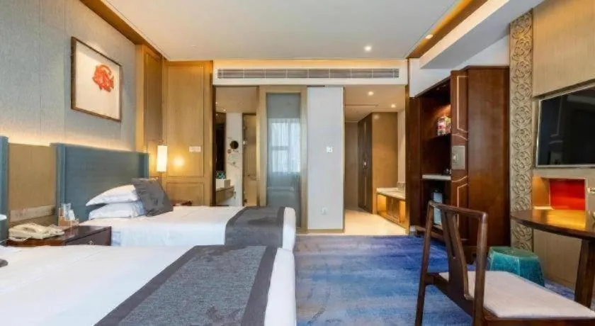 Bed in Bliss International Hotel Weihai