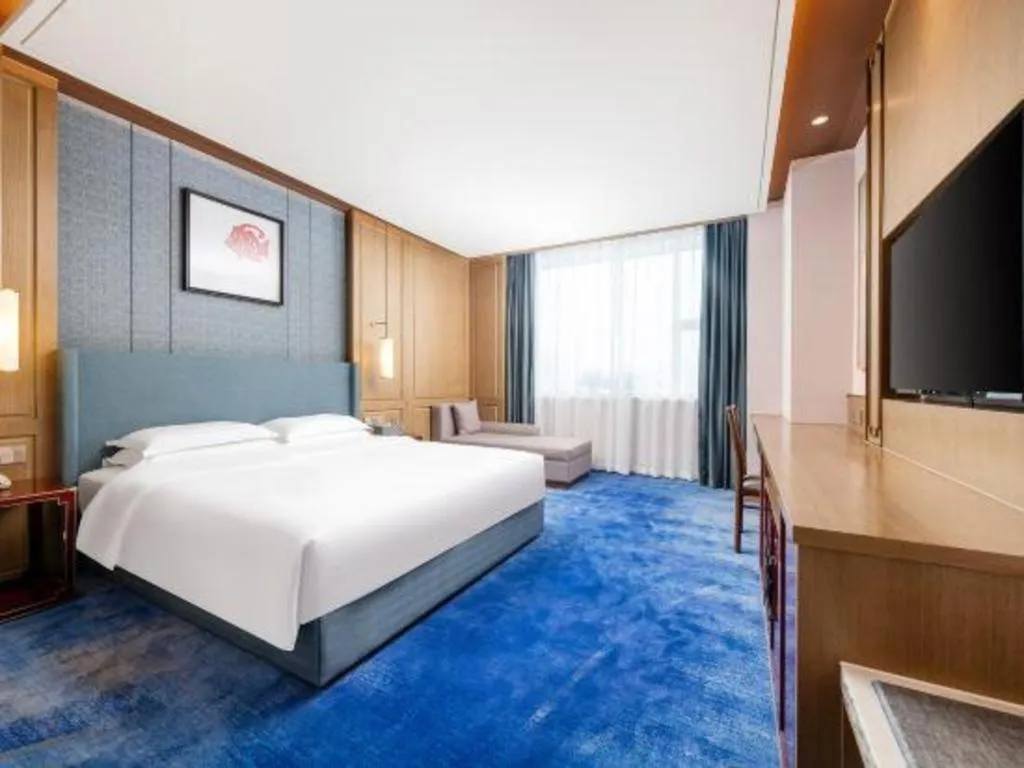 Bed in Bliss International Hotel Weihai