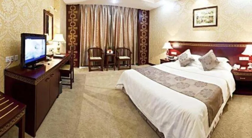 Bed in Bliss International Hotel Weihai
