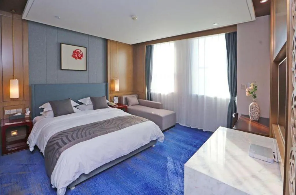 Bed in Bliss International Hotel Weihai