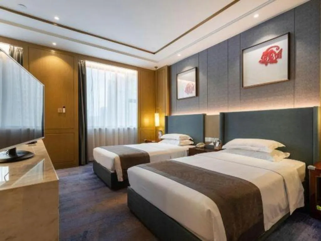 Bed in Bliss International Hotel Weihai