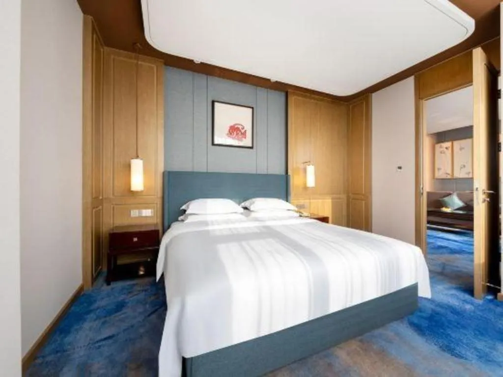 Bed in Bliss International Hotel Weihai