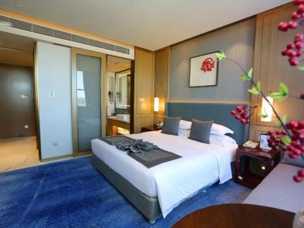 Bed in Bliss International Hotel Weihai