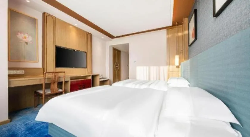 Bed in Bliss International Hotel Weihai