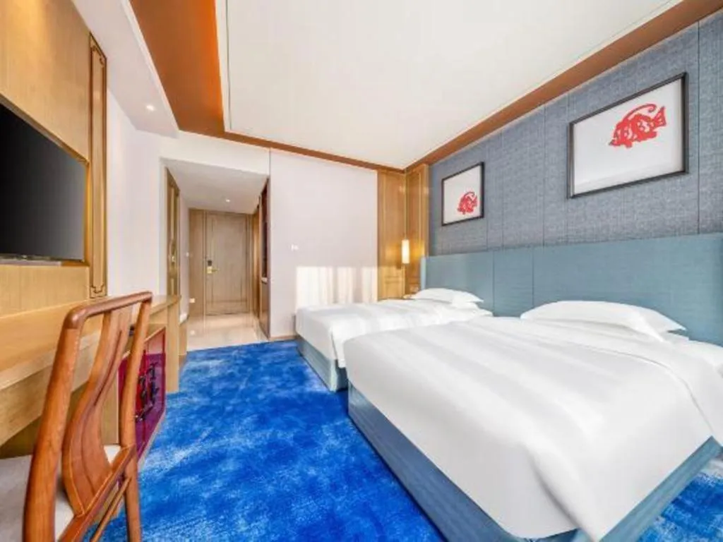 Bed in Bliss International Hotel Weihai