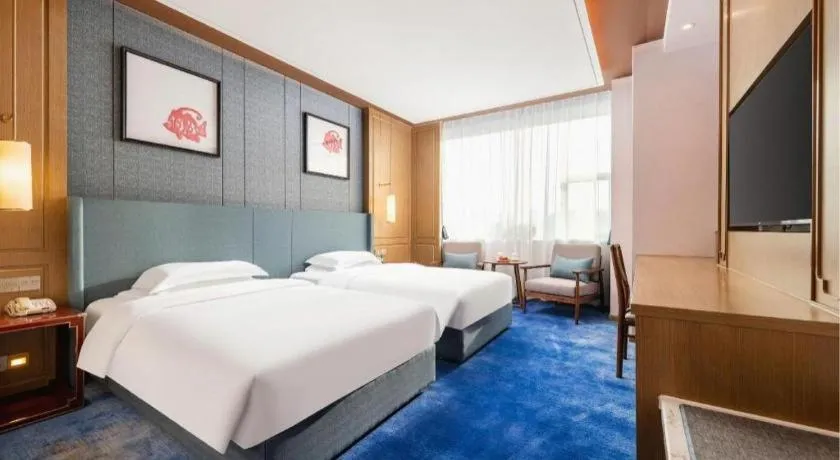 Bed in Bliss International Hotel Weihai