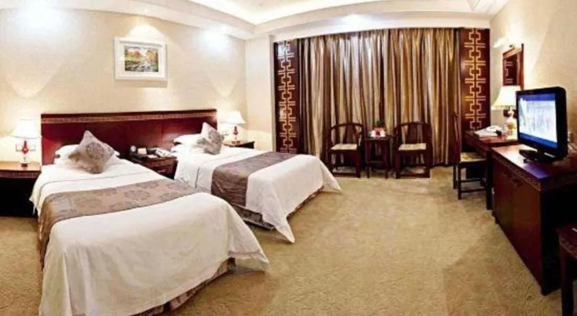 Bed in Bliss International Hotel Weihai