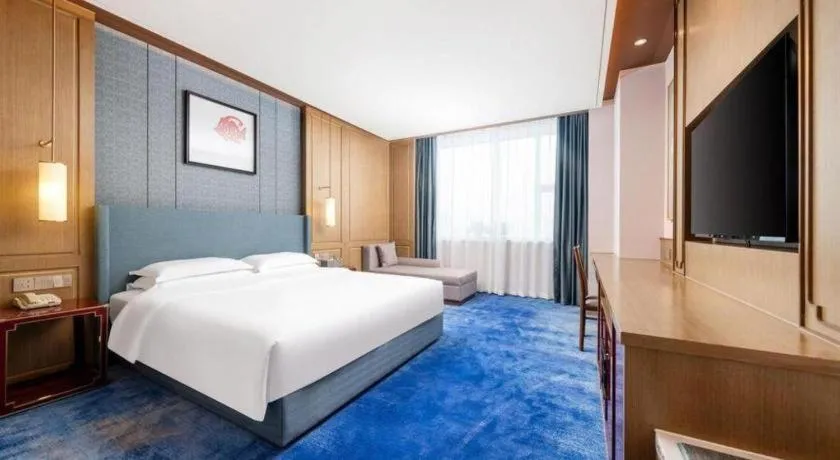 Bed in Bliss International Hotel Weihai