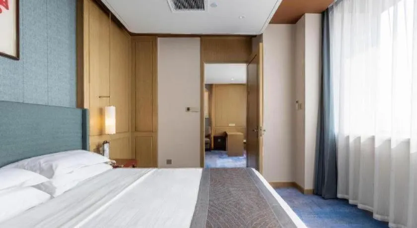 Bed in Bliss International Hotel Weihai