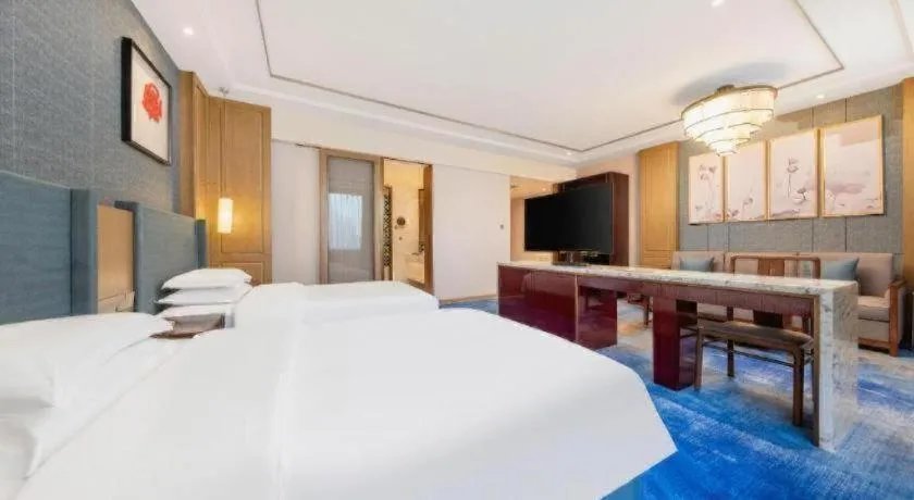 Bed in Bliss International Hotel Weihai