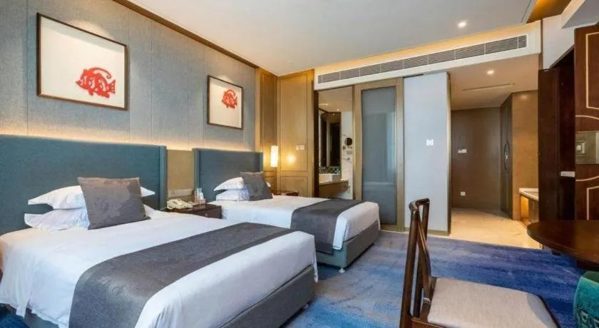 Bed in Bliss International Hotel Weihai