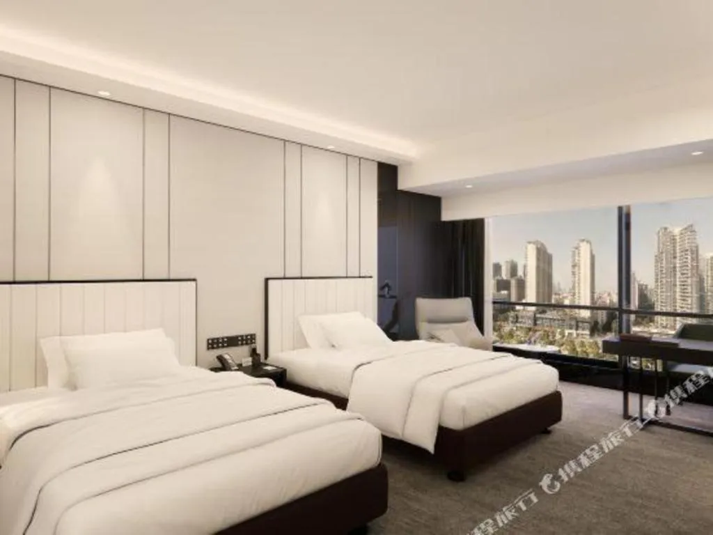 Bed in Changsha Jasmine International Hotel