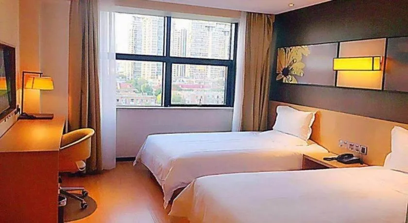 Bed in IU Hotel Tianjin Tianta Scenic Spot Wujiayao Metro Station