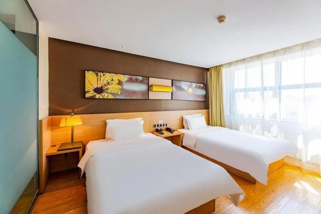 Bed in IU Hotel Tianjin Tianta Scenic Spot Wujiayao Metro Station