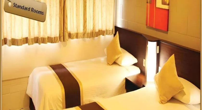 Bed in Peninsula International Hotel