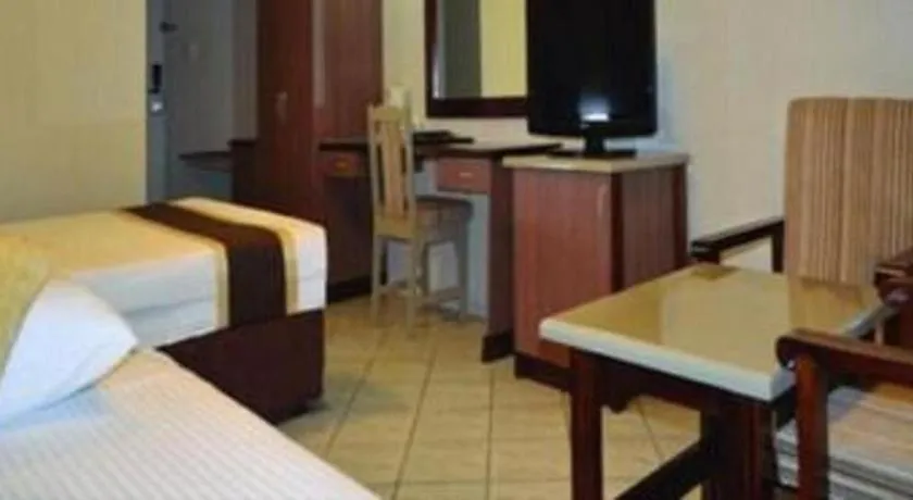 Bed in Peninsula International Hotel