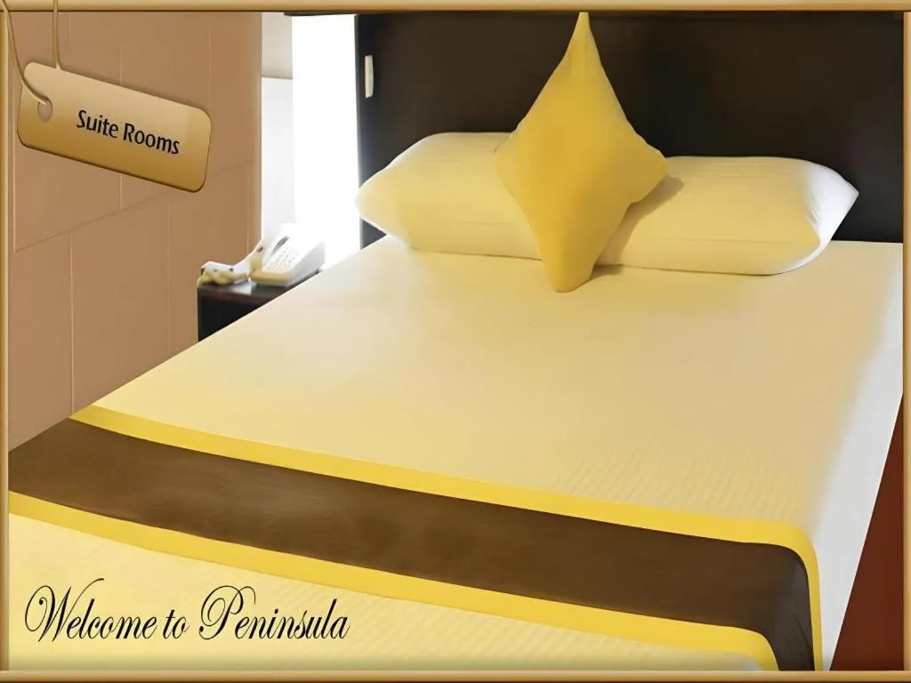 Bed in Peninsula International Hotel