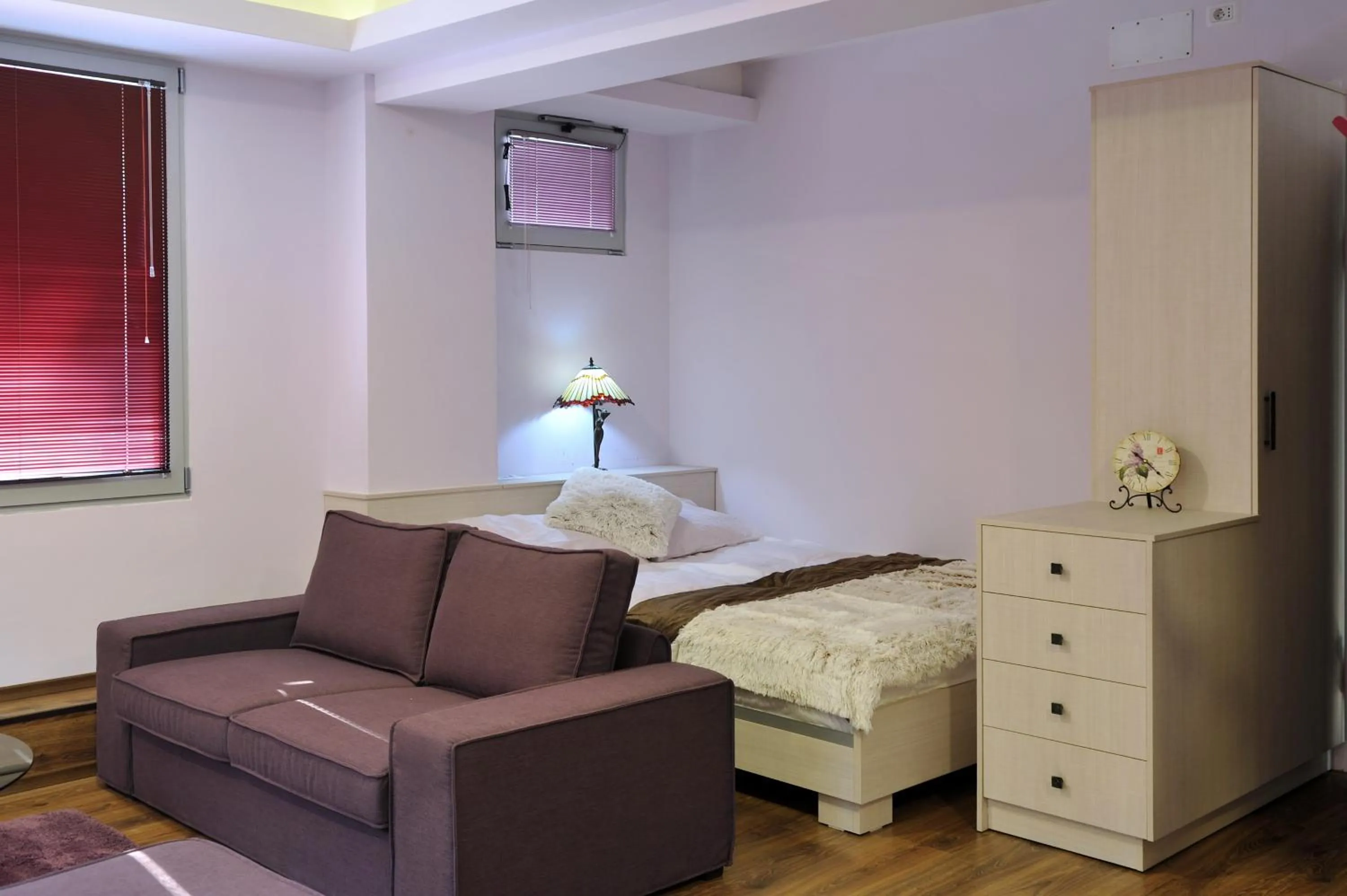 Seating area, Bed in Joan Apartments & Spa