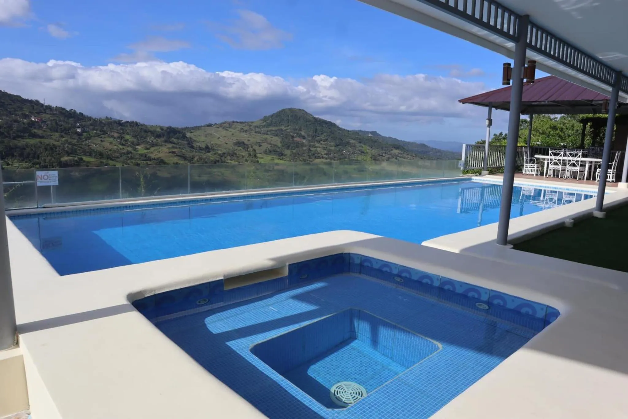 Swimming pool in Serenity Farm and Resort by Hiverooms