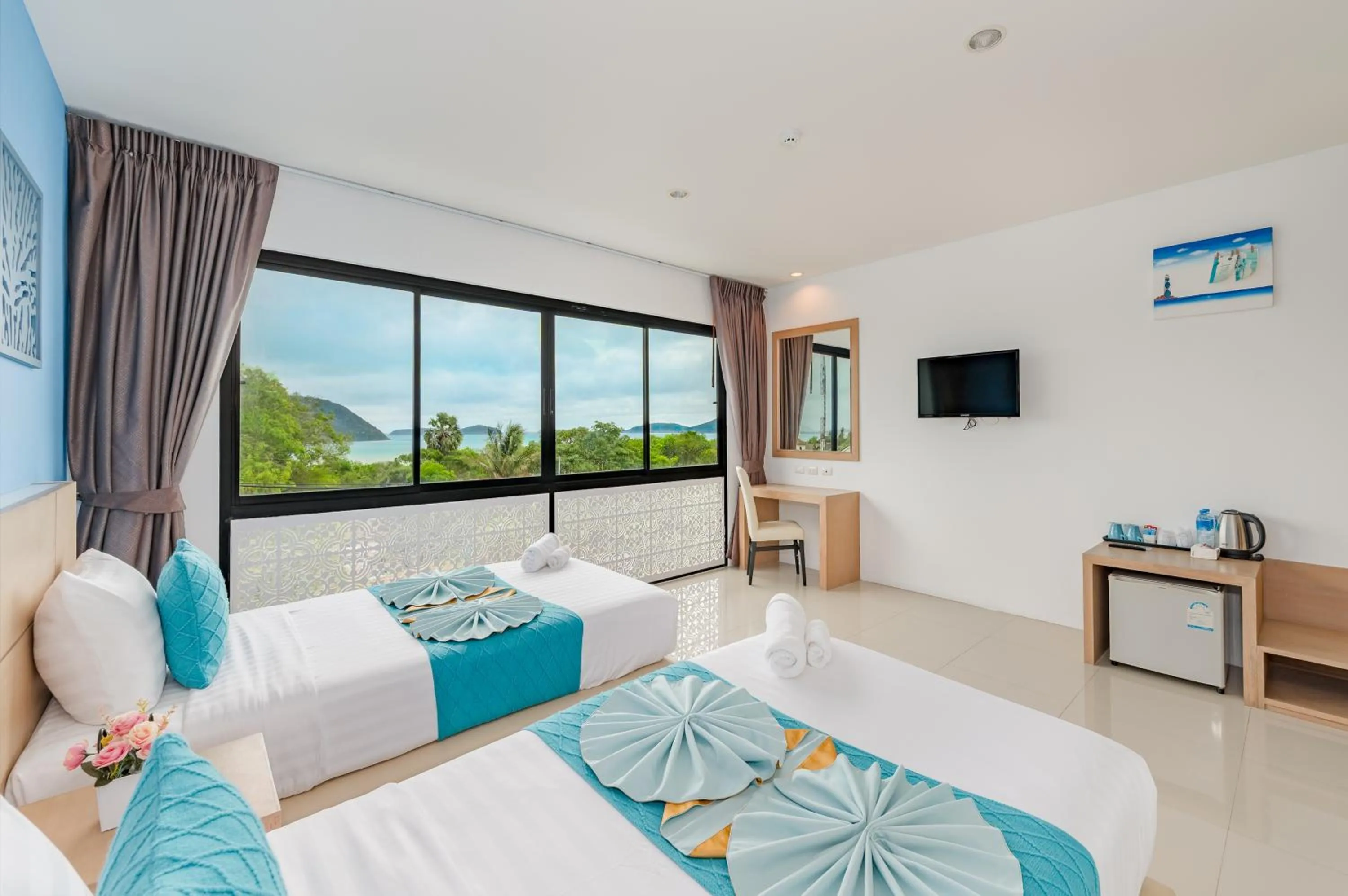 Bed in De Blue Sea Rawai Hotel