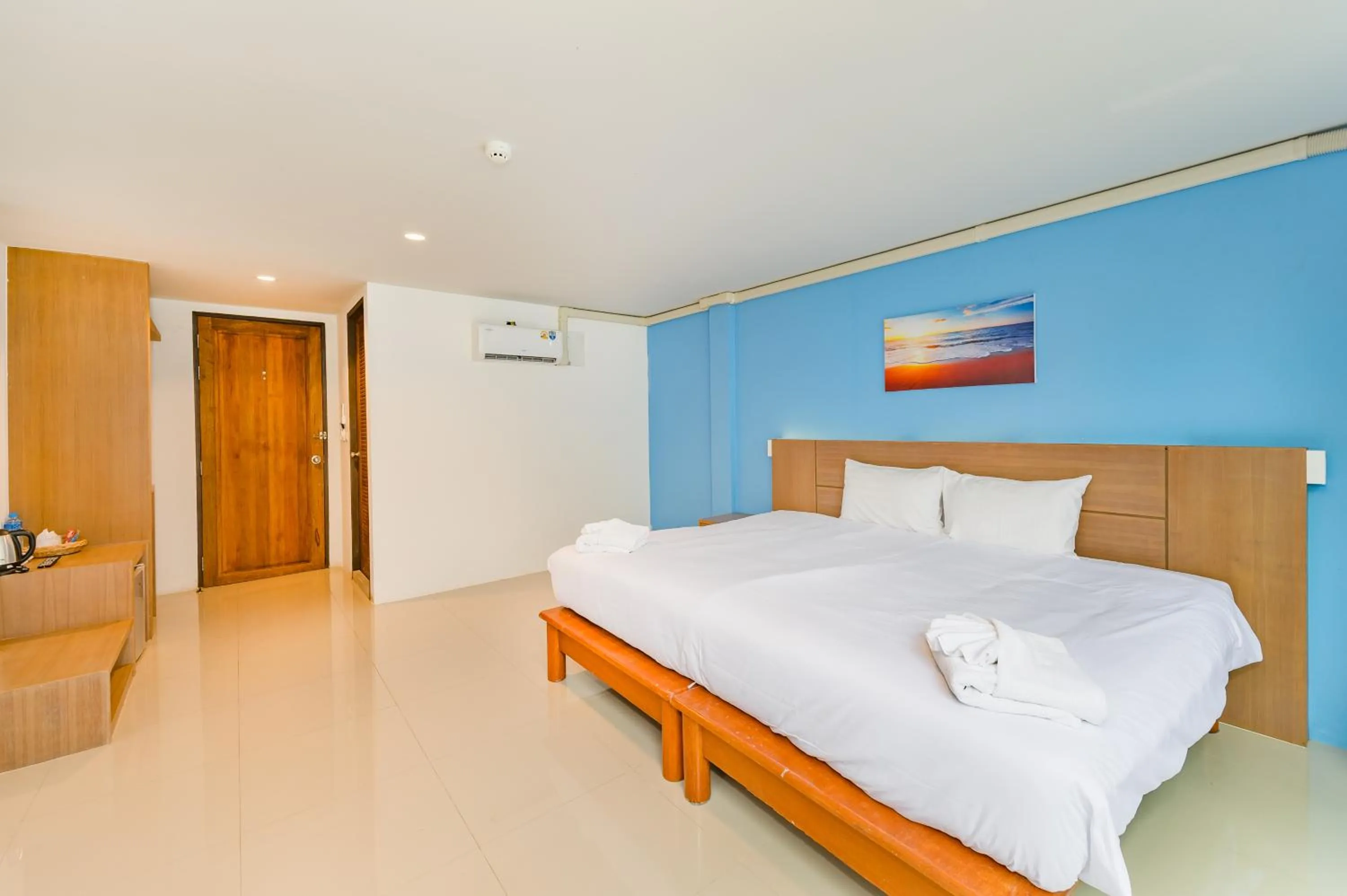 Bed in De Blue Sea Rawai Hotel