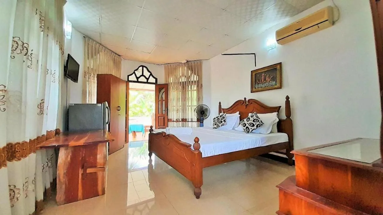Bed in Bentota River Dilu Villa