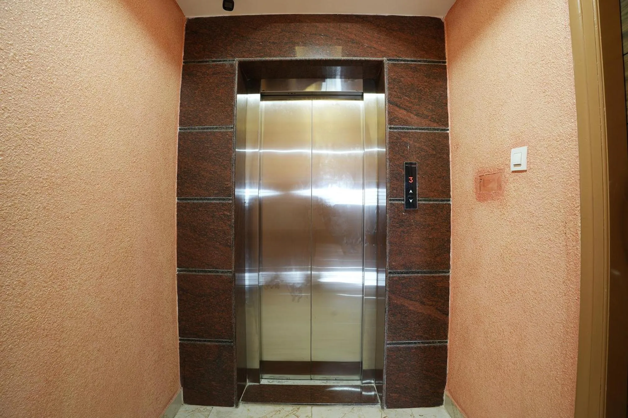 elevator in FabHotel A White Pearl Suites - Yelahanka