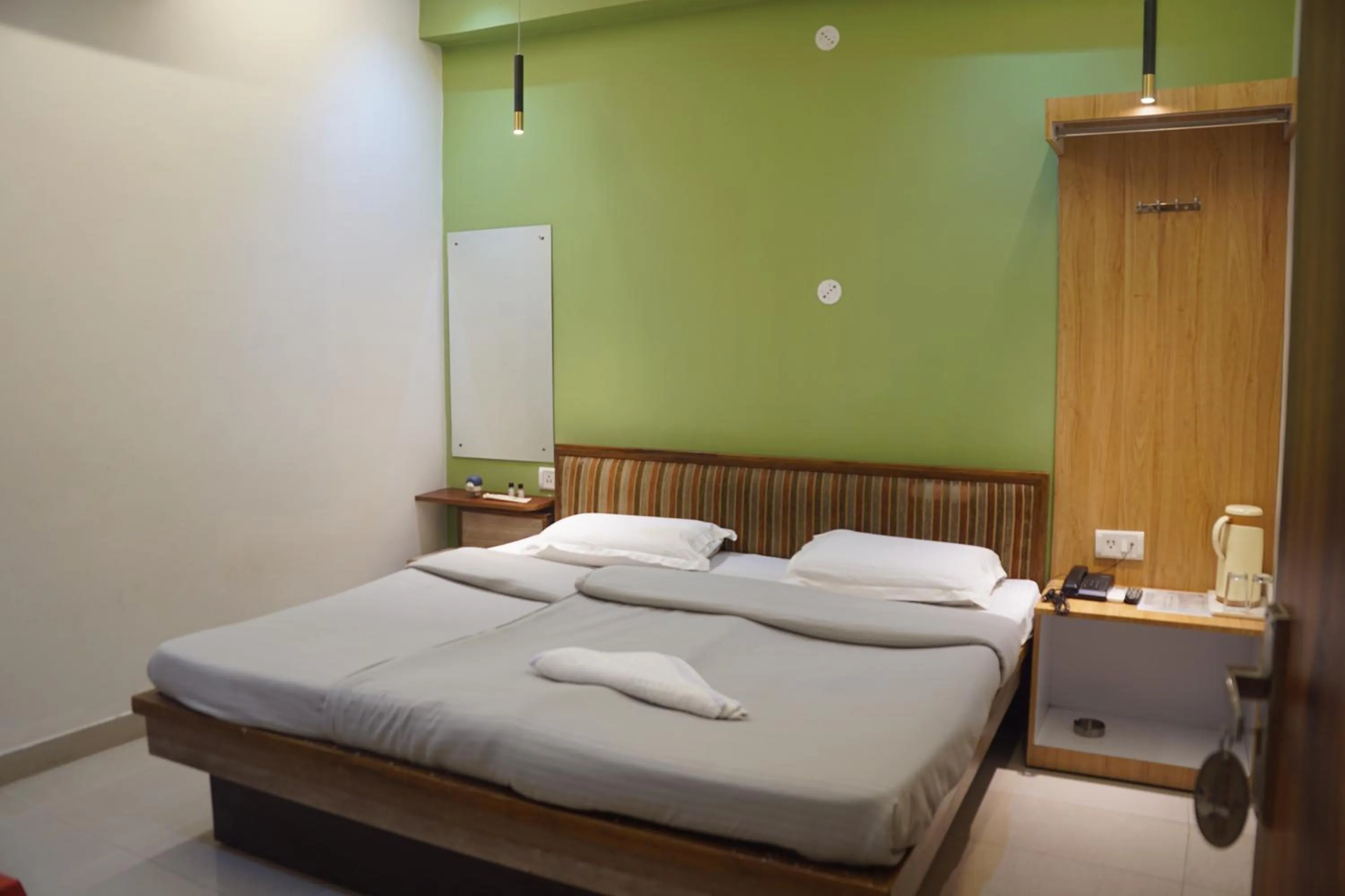 Bed in Subhash Hotel