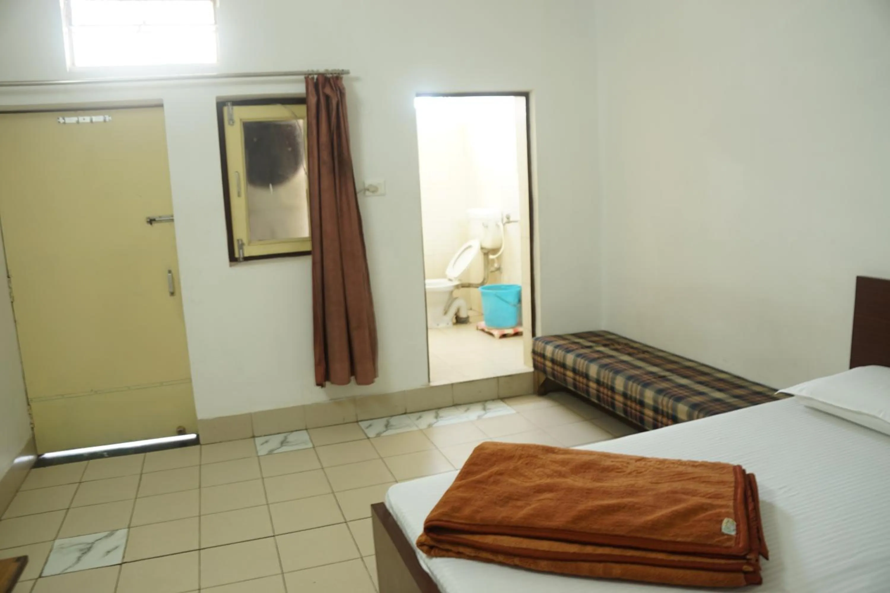 Bed in Subhash Hotel