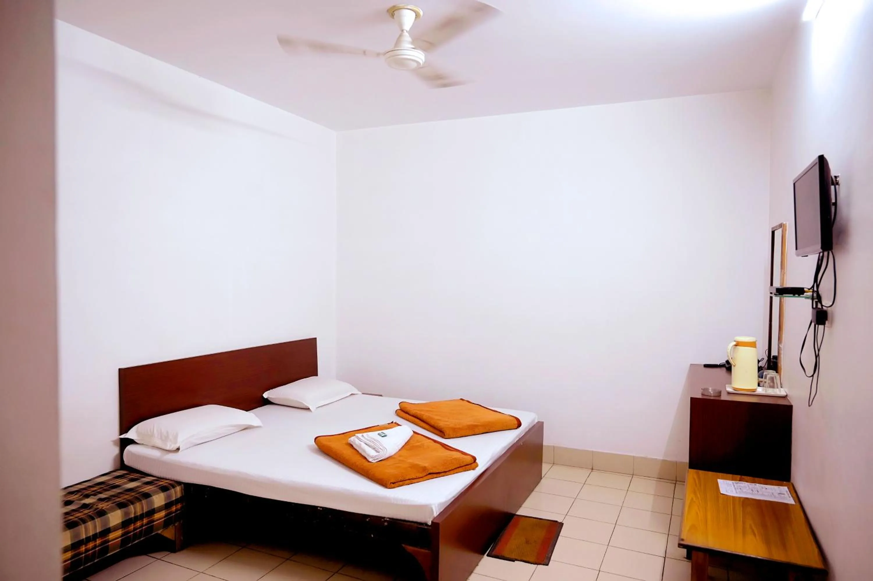 Bed in Subhash Hotel