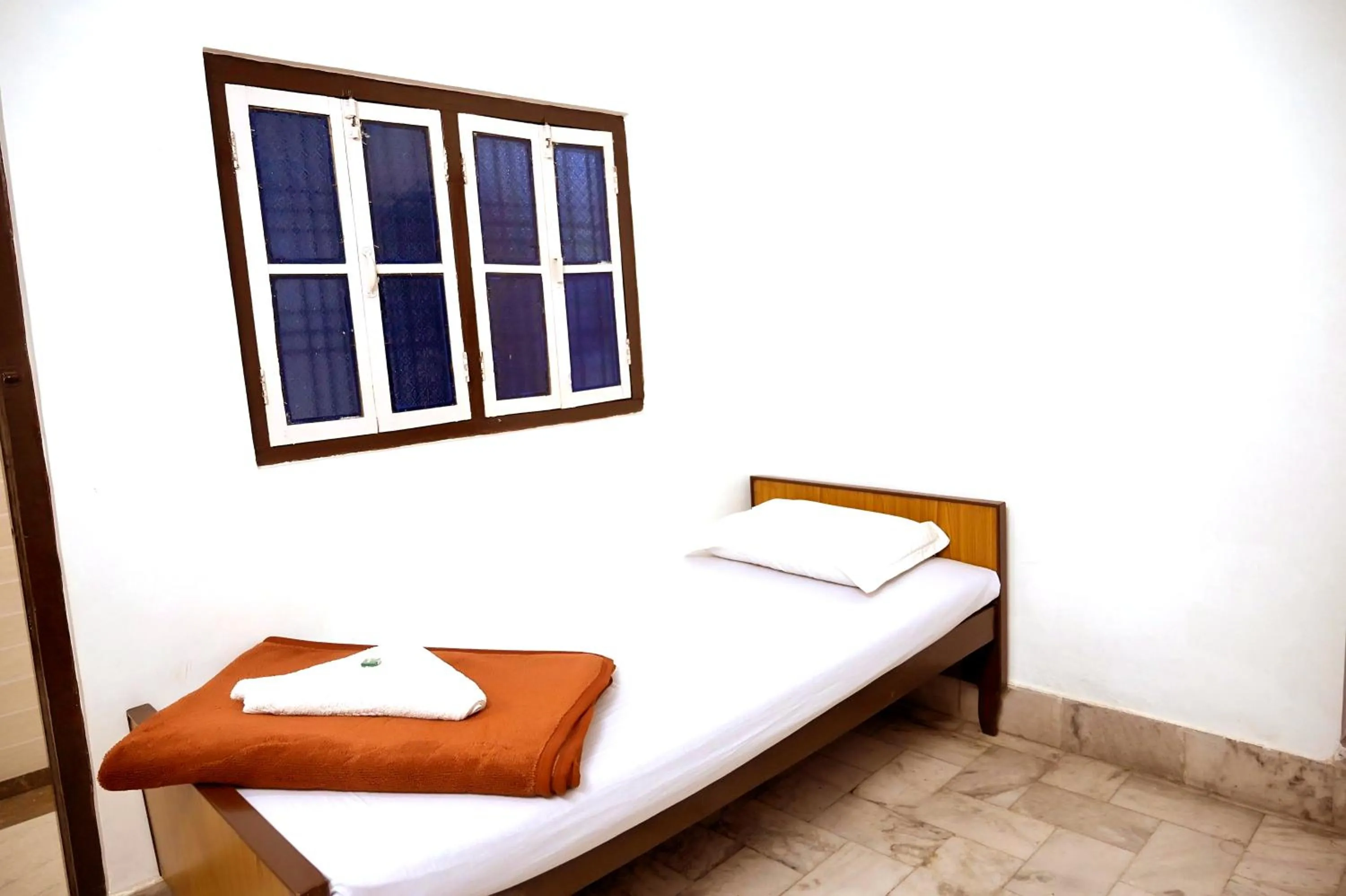 Bed in Subhash Hotel