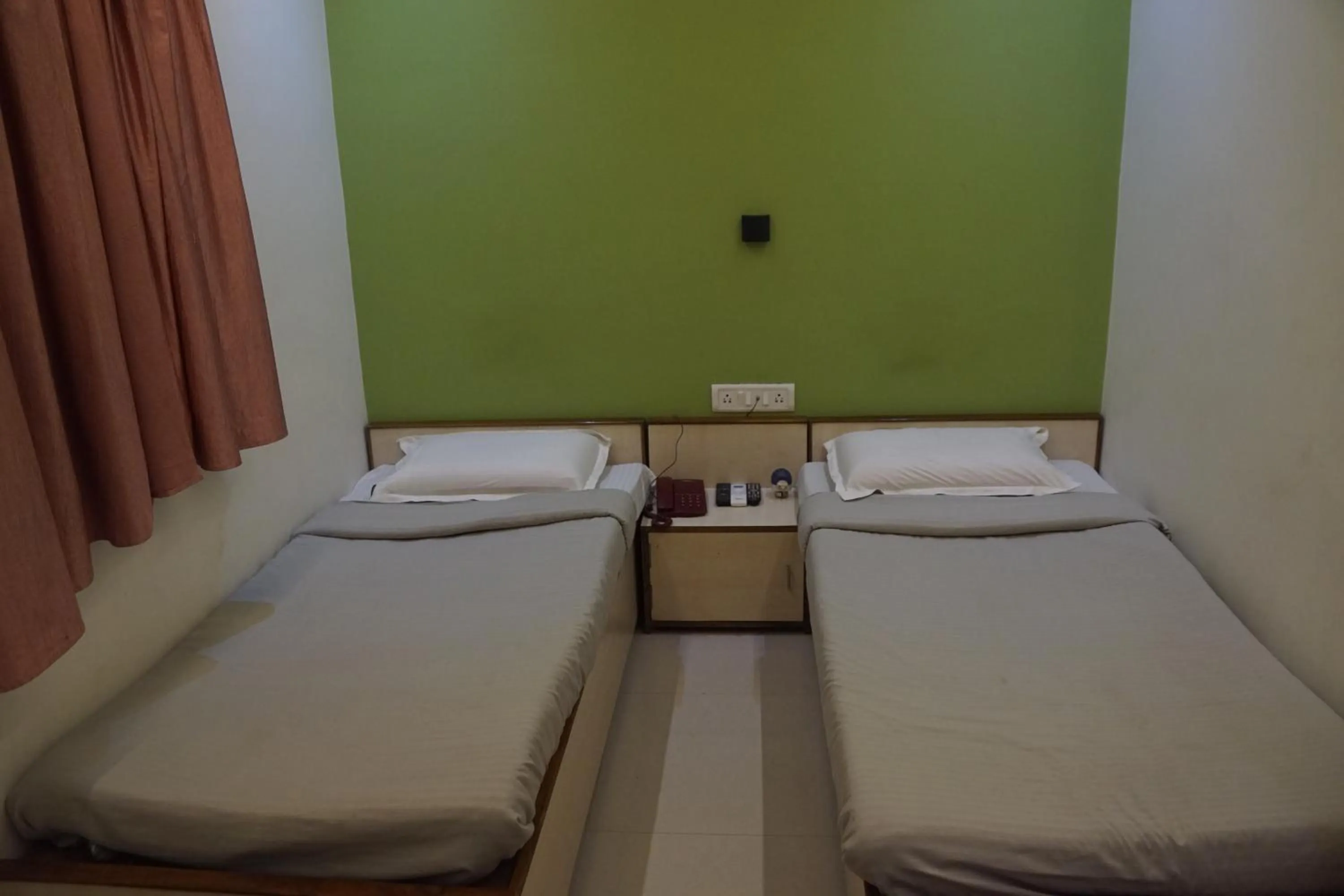 Bed in Subhash Hotel