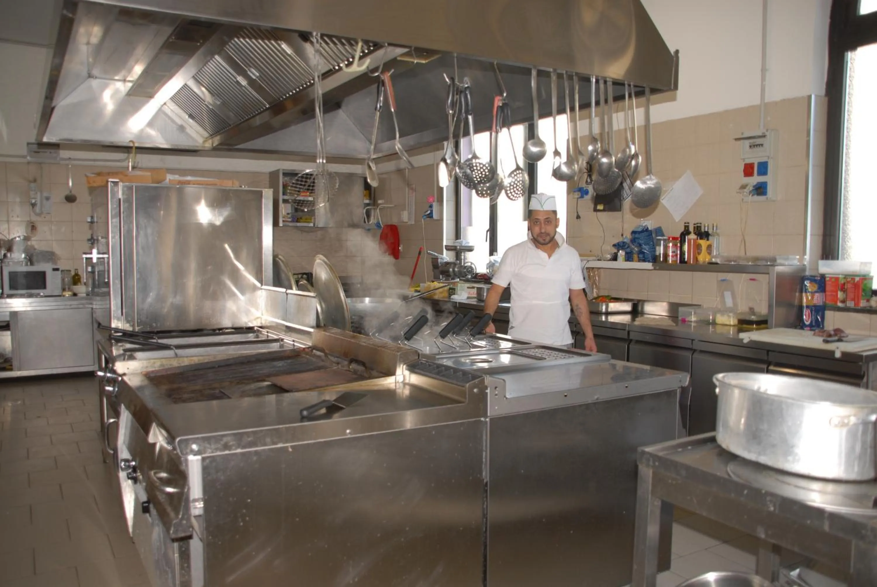 Communal kitchen in Hotel Ristorante Il Calipso by Mago