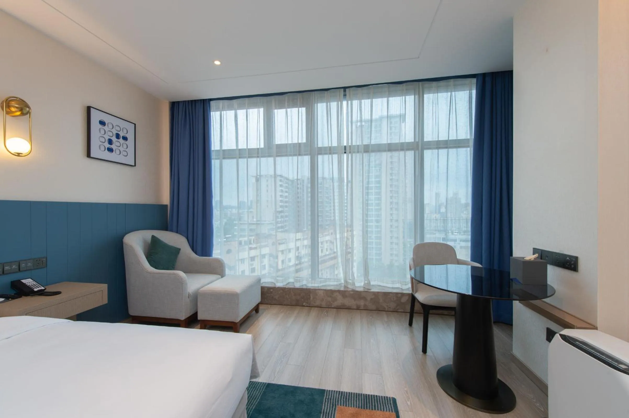 Seating area, Bed in Novotel Wuxi