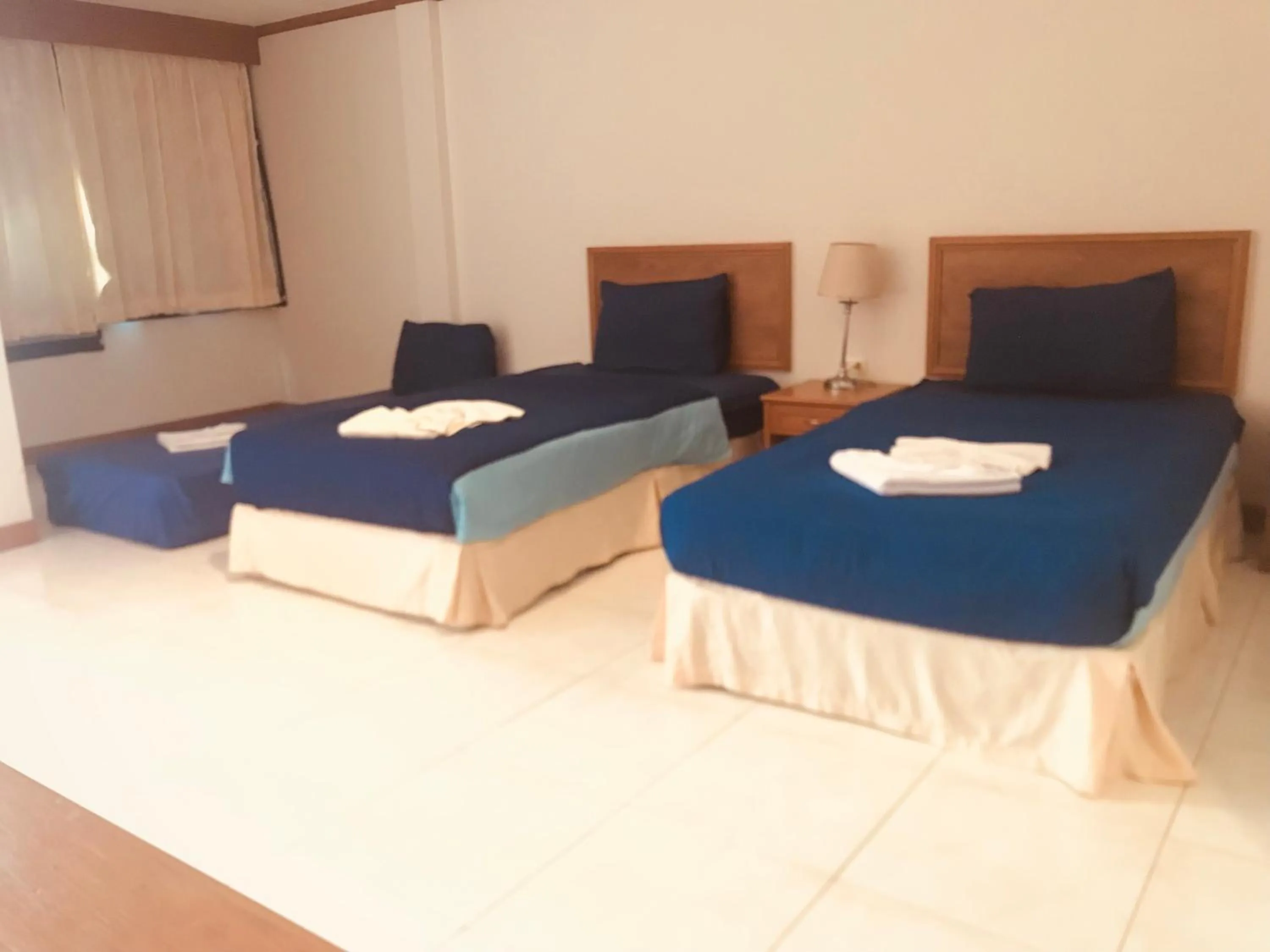 Bed in Global Hotel Beach View