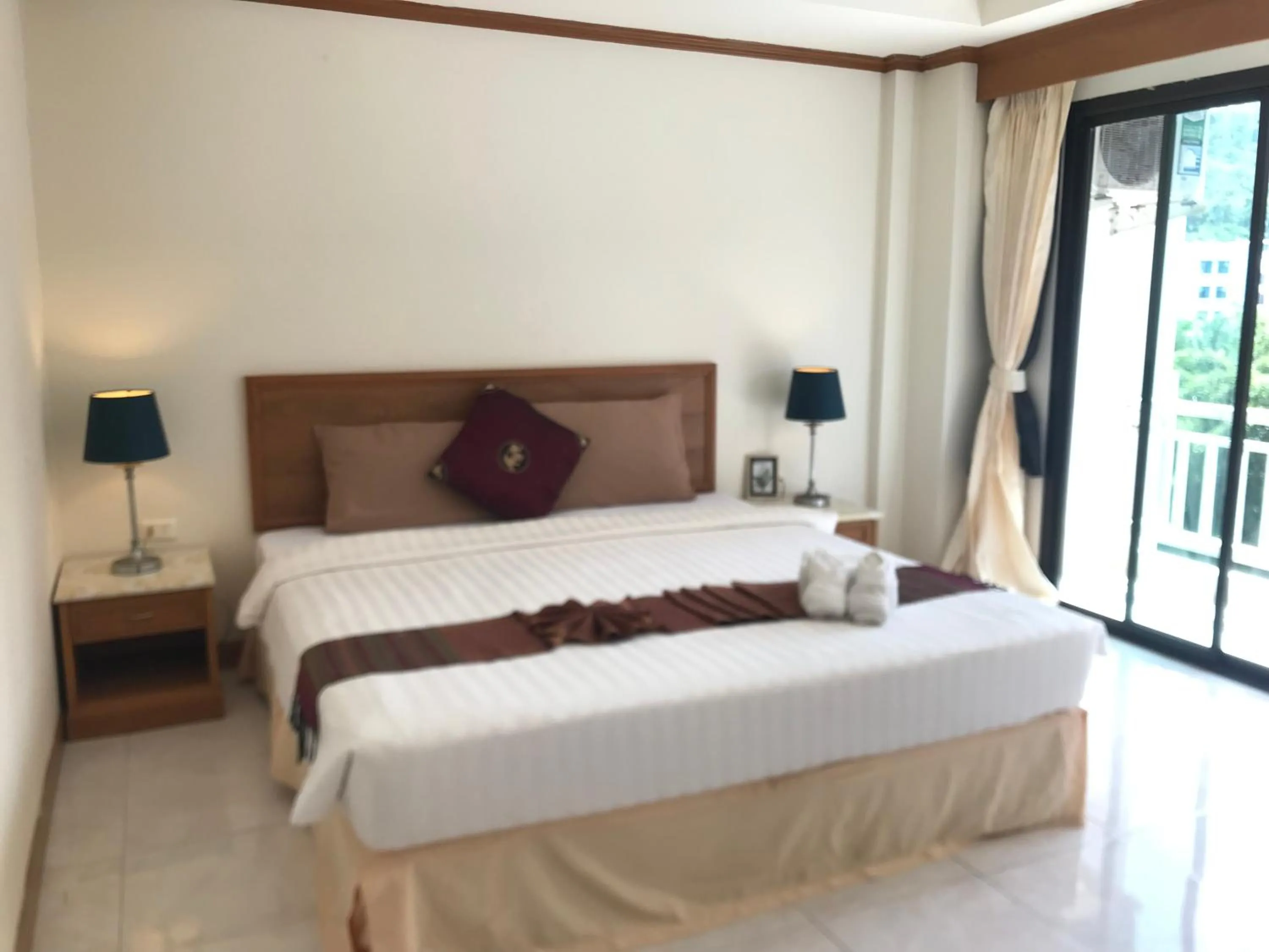 Bed in Global Hotel Beach View