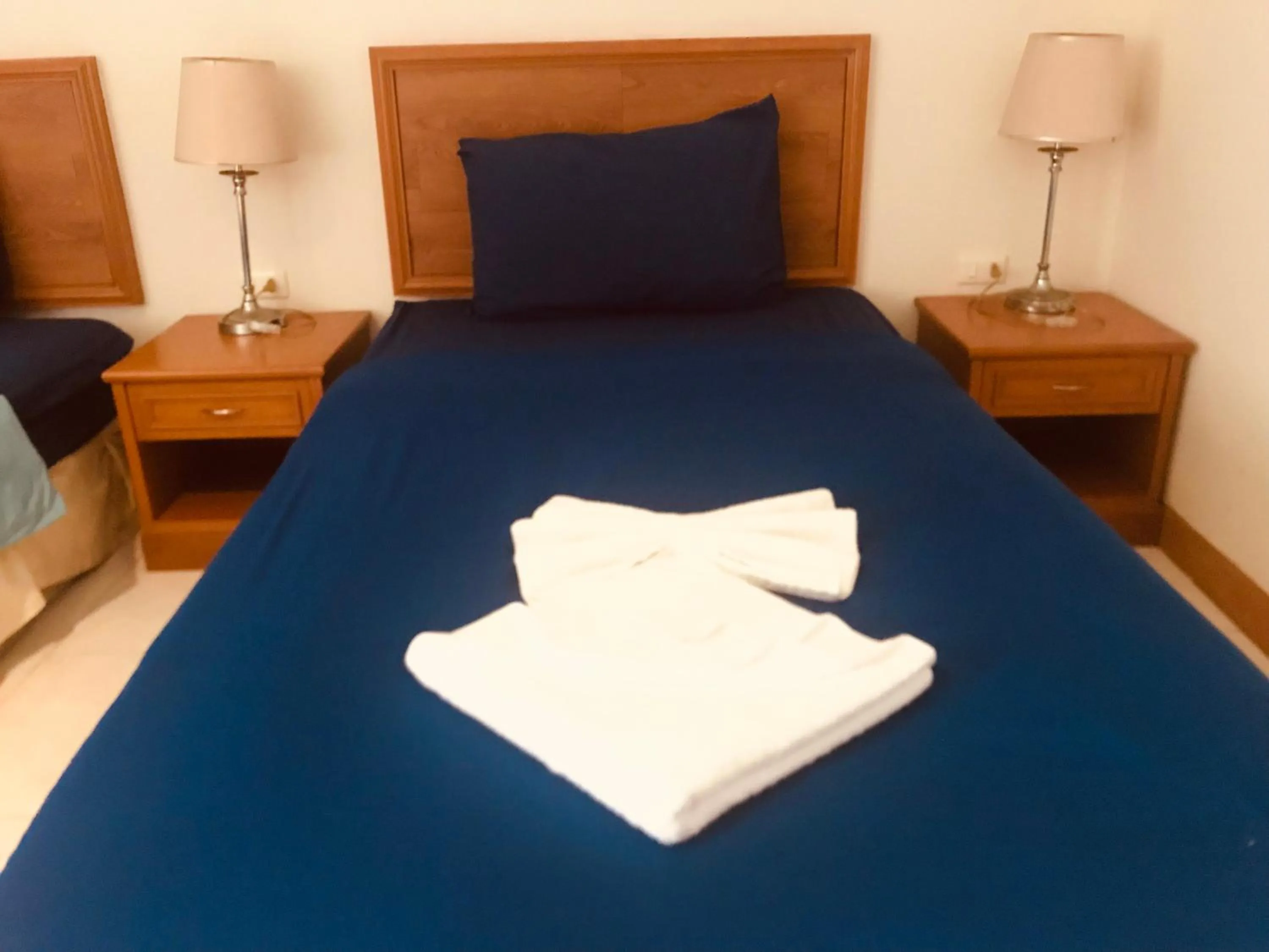 Bed in Global Hotel Beach View