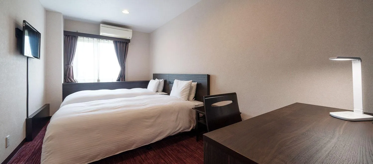 Bed in Okazaki New Grand Hotel