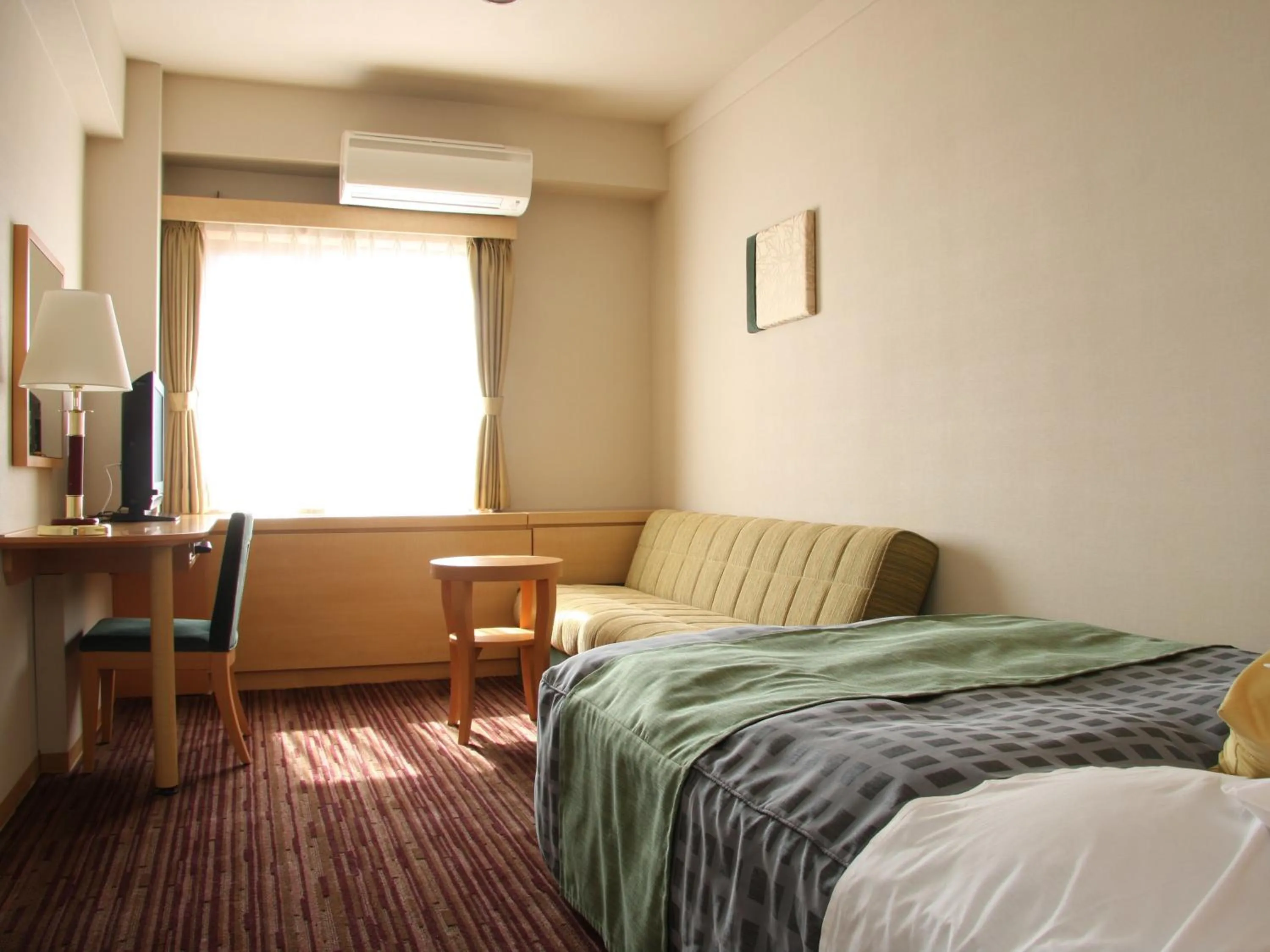 Photo of the whole room, Bed in Okazaki New Grand Hotel