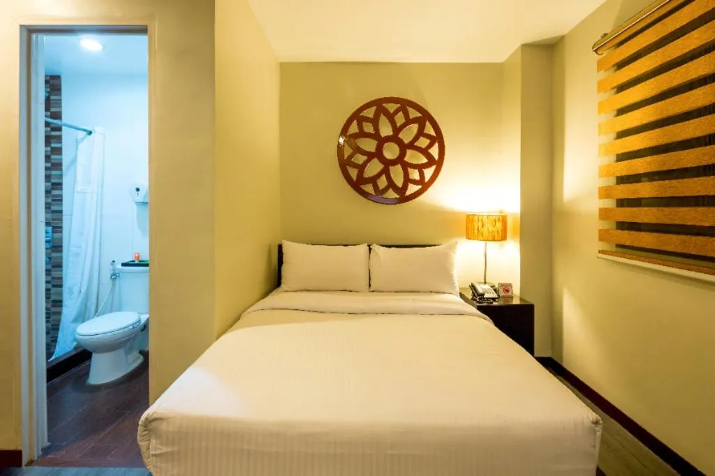 Bed in L Square Hotel