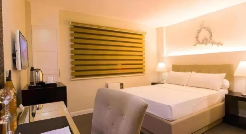 Bed in L Square Hotel