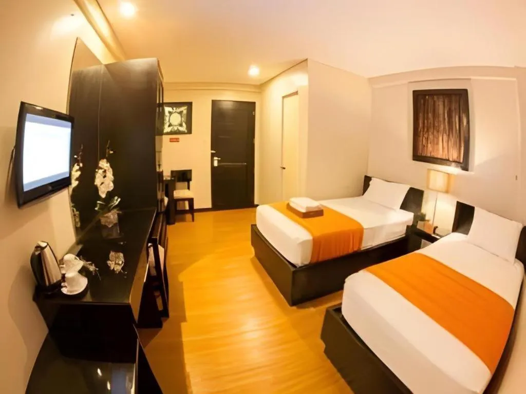 Bed in L Square Hotel