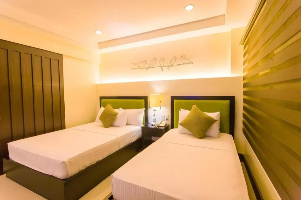 Bed in L Square Hotel