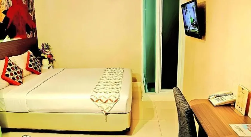 Bed in Clay Hotel Jakarta