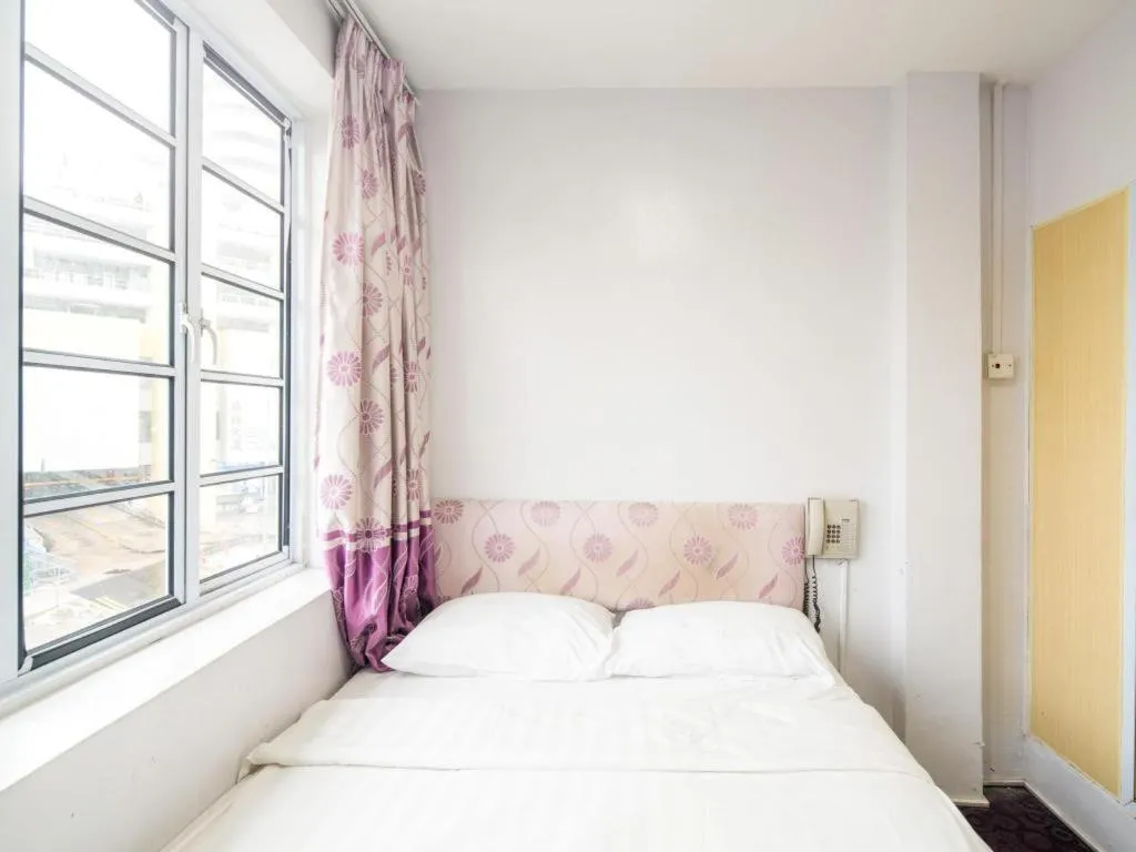 Bed in Meriton Hotel