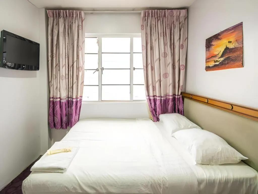 Bed in Meriton Hotel