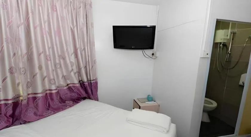 Bed in Meriton Hotel