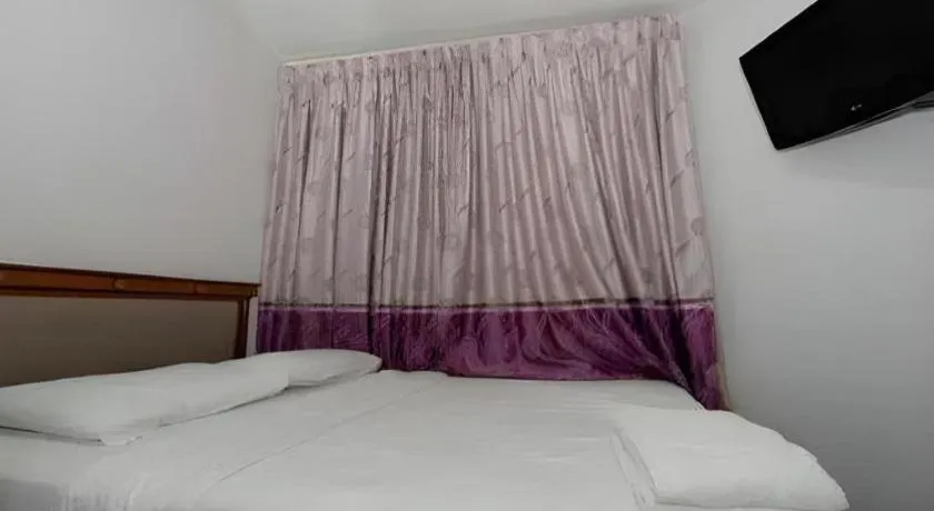 Bed in Meriton Hotel