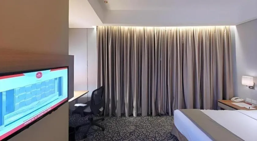 Bed in Hotel GranDhika Iskandarsyah