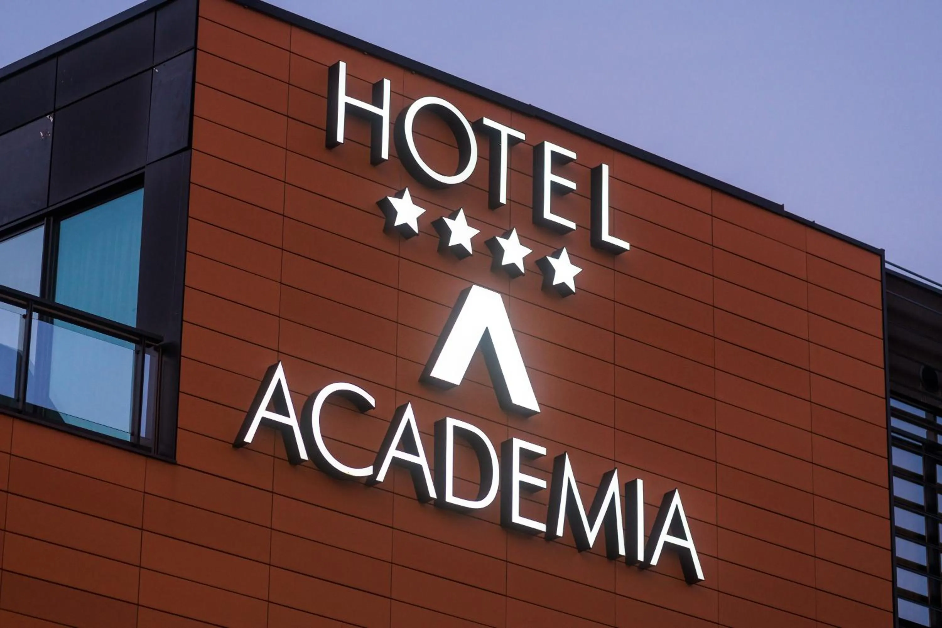 Property logo or sign in Hotel Academia